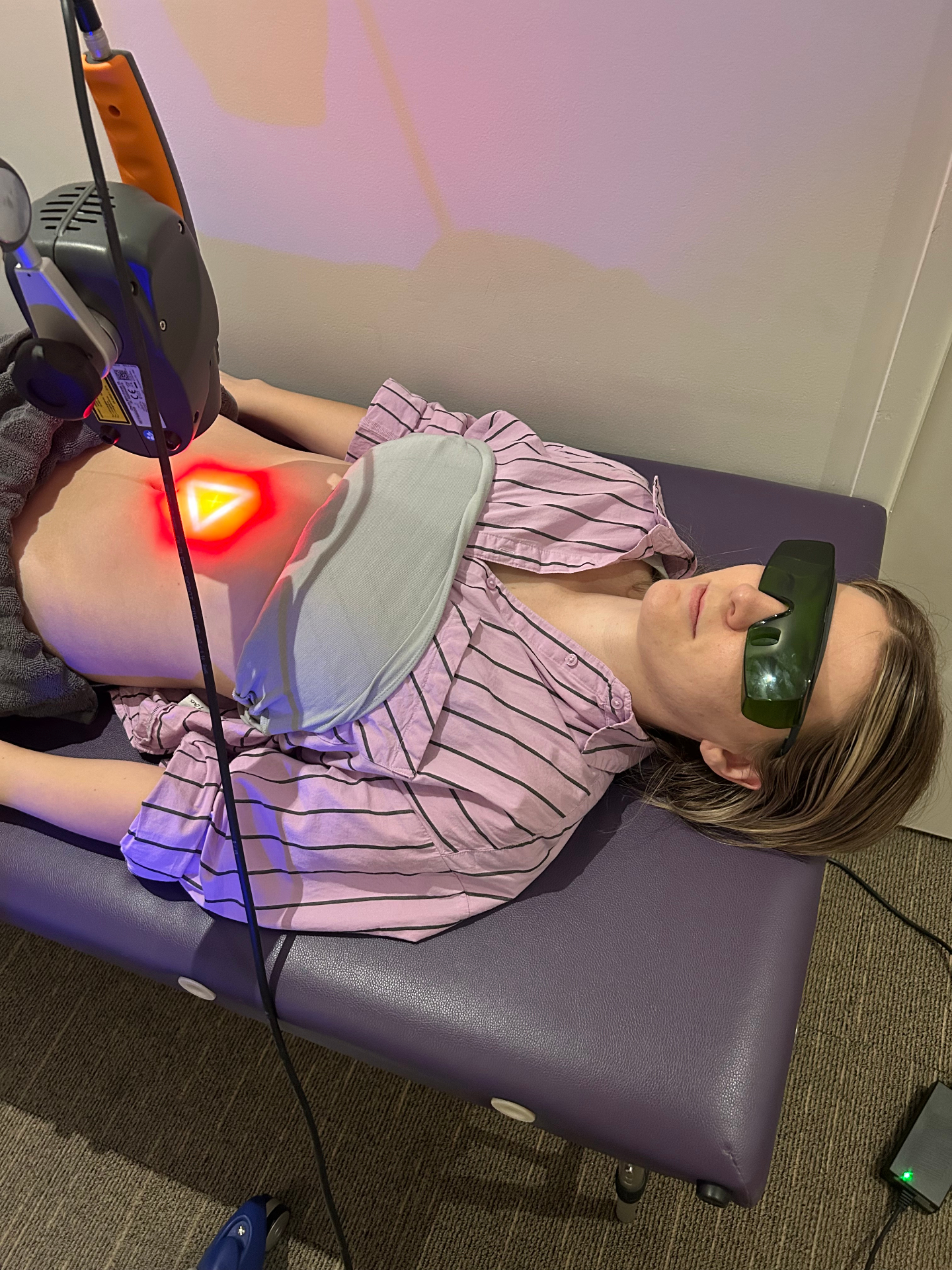 Patient receiving MLS Laser therapy treatment for pain relief