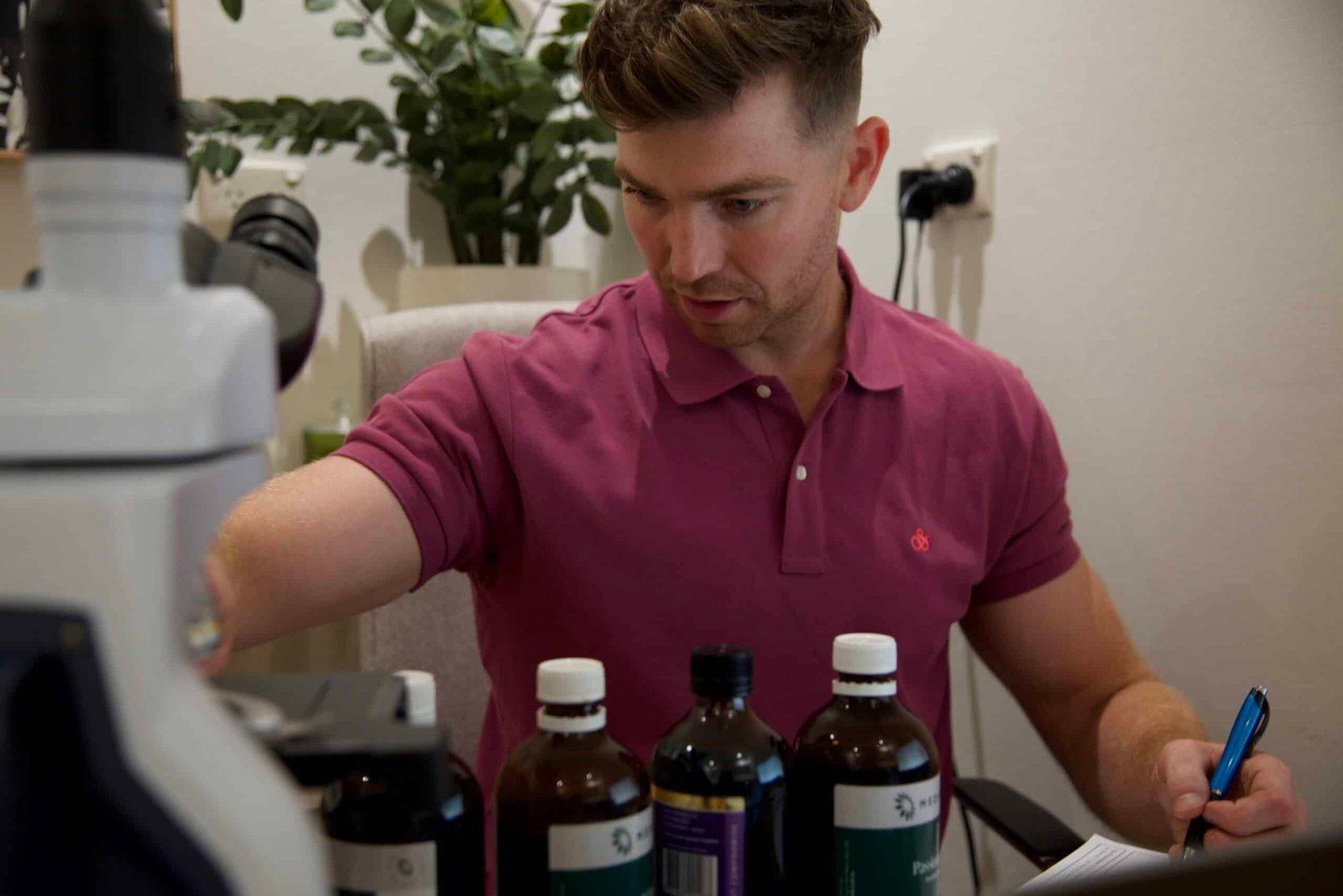 Naturopath doing paperwork at desk